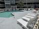 Relaxing pool area with lounge chairs and well-maintained swimming pool near the residential building at 1101 Possum Trot Rd. # A202, North Myrtle Beach, SC 29582