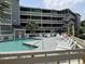 Inviting community pool with ample seating and sunbathing opportunities at 1101 Possum Trot Rd. # A202, North Myrtle Beach, SC 29582