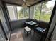 Cozy sunroom with ceiling fan and great natural light is perfect for relaxing at 1101 Possum Trot Rd. # A202, North Myrtle Beach, SC 29582