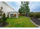 Well-maintained backyard features a covered patio, outdoor kitchen, and lush lawn at 112 Molinia Dr., Murrells Inlet, SC 29576