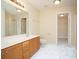Bathroom with double vanity, updated lighting, and large mirror at 112 Molinia Dr., Murrells Inlet, SC 29576
