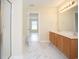Bright primary bathroom boasts a double sink vanity, tub-shower combo, and marble floors at 112 Molinia Dr., Murrells Inlet, SC 29576