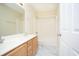 Well-lit bathroom boasts double sinks, modern floors, and a tub with shower at 112 Molinia Dr., Murrells Inlet, SC 29576