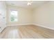 Bright and open bedroom with wood flooring and a window, with a ceiling fan at 112 Molinia Dr., Murrells Inlet, SC 29576