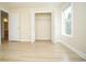 Bedroom with wood floors and a closet has bright natural light at 112 Molinia Dr., Murrells Inlet, SC 29576