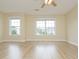 Large bedroom features wood flooring and large windows for natural light at 112 Molinia Dr., Murrells Inlet, SC 29576