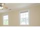 Bright bedroom with large windows and neutral walls, offering a serene atmosphere at 112 Molinia Dr., Murrells Inlet, SC 29576
