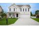 Charming two-story home with light siding, black shutters, and a well-manicured lawn at 112 Molinia Dr., Murrells Inlet, SC 29576