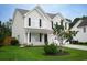 Charming two-story home with a well-manicured lawn and a welcoming front porch at 112 Molinia Dr., Murrells Inlet, SC 29576