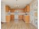 Bright kitchen featuring ample counter space, white appliances, and wood cabinetry at 112 Molinia Dr., Murrells Inlet, SC 29576