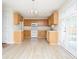 Bright kitchen featuring ample counter space, white appliances, and wood cabinetry at 112 Molinia Dr., Murrells Inlet, SC 29576