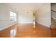Spacious living room featuring hardwood floors, a large window, and neutral paint at 112 Molinia Dr., Murrells Inlet, SC 29576