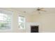 Cozy living room with a fireplace, ceiling fan, and plenty of natural light from two windows at 112 Molinia Dr., Murrells Inlet, SC 29576