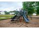 Community playground with climbing and sliding features set next to a pond at 112 Molinia Dr., Murrells Inlet, SC 29576