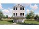New construction, a charming three-story home featuring a classic design and inviting curb appeal at 1203 Salt Windy Way, North Myrtle Beach, SC 29582