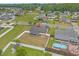 Aerial view of home showcasing backyard, fencing, and a neighboring pool, nestled in community at 1220 Dunraven Ct., Conway, SC 29527