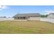 Large, fenced backyard showcasing a covered patio, providing privacy and space for outdoor activities at 1220 Dunraven Ct., Conway, SC 29527