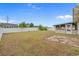 Sprawling backyard enclosed by a white fence, offering ample space for recreation and relaxation at 1220 Dunraven Ct., Conway, SC 29527