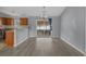 Dining room showing the wooden cabinets in the kitchen and the sliding door access to the screened-in porch at 1220 Dunraven Ct., Conway, SC 29527