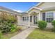 Inviting front porch features decorative columns and a glass door entrance to home at 1220 Dunraven Ct., Conway, SC 29527