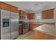 Galley kitchen with stainless appliances, solid surface countertops, and generous cabinet storage at 1220 Dunraven Ct., Conway, SC 29527