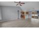 Open-concept living room view to the kitchen featuring hardwood style floors and neutral paint tones at 1220 Dunraven Ct., Conway, SC 29527
