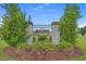 Entrance featuring the New Castle community nameplate, framed by lush greenery under a clear sky at 1220 Dunraven Ct., Conway, SC 29527
