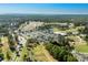 Sea Trail golf resort aerial showcasing the golf course, clubhouse, parking, and surrounding landscape at 1308 Piper Glen Dr, Sunset Beach, NC 28468