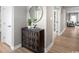 Entryway with a modern dresser, mirror, and hardwood floors at 1308 Piper Glen Dr, Sunset Beach, NC 28468