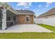 Backyard featuring a concrete patio, brick accents, and a well-maintained lawn, perfect for outdoor entertaining at 131 Crabapple Dr., Longs, SC 29568