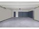 Clean, well-lit two-car garage with painted walls and epoxy flooring, offering ample space for vehicles and storage at 131 Crabapple Dr., Longs, SC 29568