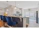 Modern kitchen with granite countertops, stylish blue barstools, and stainless steel appliances at 131 Crabapple Dr., Longs, SC 29568
