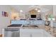 Open kitchen featuring granite countertops, stainless steel appliances, and a view of the adjacent living space at 131 Crabapple Dr., Longs, SC 29568