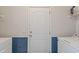 Functional laundry room with white appliances and blue tile accents at 131 Crabapple Dr., Longs, SC 29568