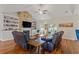 Cozy living room with a brick fireplace, built-in bookshelves, and sliding glass doors to the patio at 131 Crabapple Dr., Longs, SC 29568