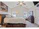 Spacious main bedroom featuring a high ceiling, a large bed, a dresser, and windows for plenty of natural light at 131 Crabapple Dr., Longs, SC 29568
