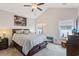 Spacious main bedroom with a vaulted ceiling, complemented by an inviting ambiance and natural light at 131 Crabapple Dr., Longs, SC 29568