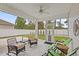 Relaxing screened porch with comfortable seating and a view of the backyard at 131 Crabapple Dr., Longs, SC 29568
