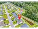 Aerial view shows property with backyard pond and the surrounding neighborhood at 135 Maggie Way, Myrtle Beach, SC 29588