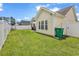 Expansive backyard with well-maintained lawn and white privacy fence at 135 Maggie Way, Myrtle Beach, SC 29588