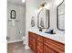 Bathroom with double sinks, stylish mirrors, and elegant black hardware at 135 Maggie Way, Myrtle Beach, SC 29588