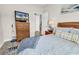 Cozy bedroom features wood floors, dresser with TV, and comfortable bed with stylish throw pillows at 135 Maggie Way, Myrtle Beach, SC 29588