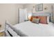 Bedroom with neutral walls, a four-poster bed, and an ensuite bathroom at 135 Maggie Way, Myrtle Beach, SC 29588