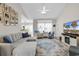 Comfortable living room with large sectional, television, and open access to the kitchen area at 135 Maggie Way, Myrtle Beach, SC 29588