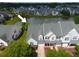 Aerial view of the home in a community with a pond and landscaping at 153 Wimbledon Way # 153, Murrells Inlet, SC 29576