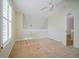 Bedroom showcases neutral carpet, light walls, and plantation shutters next to the staircase and landing at 153 Wimbledon Way # 153, Murrells Inlet, SC 29576