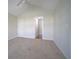 Clean bedroom with neutral carpet, high ceilings, and open doorway at 153 Wimbledon Way # 153, Murrells Inlet, SC 29576