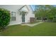 A quaint entrance with a green glass front door and manicured lawn at 153 Wimbledon Way # 153, Murrells Inlet, SC 29576