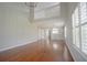 Open concept living area showcasing hardwood floors, high ceilings, and natural light at 153 Wimbledon Way # 153, Murrells Inlet, SC 29576