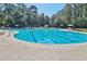 Large community pool with clear blue water, lane markers, and ample seating for residents at 1550 Spinnaker Dr. # 3123, North Myrtle Beach, SC 29582